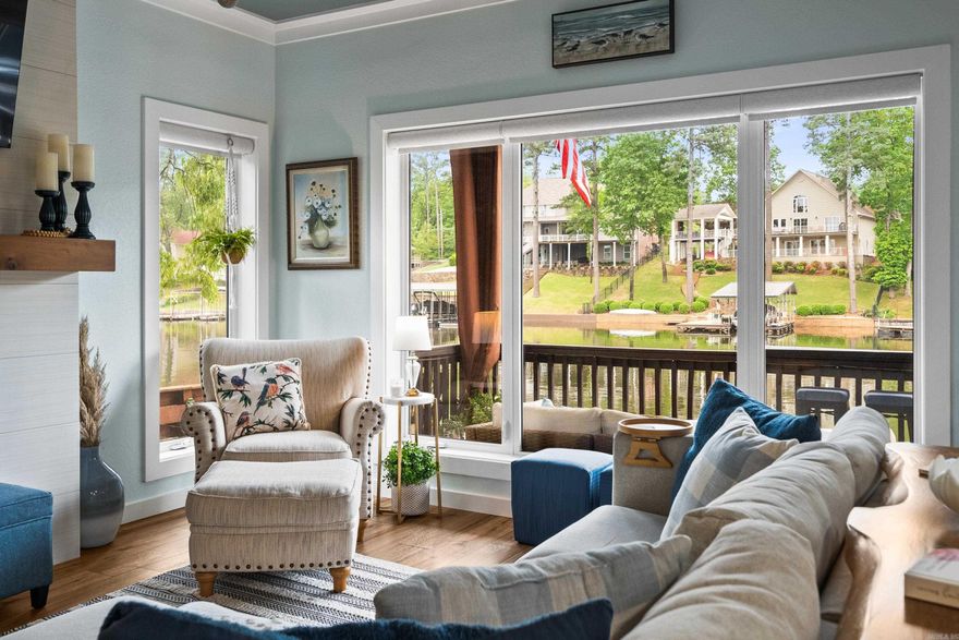 Every inch of this beautifully updated Lake Hamilton condo has been carefully renovated with high-end finishes and thoughtful touches throughout. Just steps from the water, you’ll walk in the front door and immediately feel right at home in a space that perfectly balances modern comfort with relaxed lakefront vibes. The open living and kitchen area is filled with natural light thanks to large windows that showcase stunning views of the lake. There’s a cozy electric fireplace for chilly evenings and powered curtains you can adjust with the touch of a button. The kitchen is as stylish as it is functional, featuring Whirlpool appliances, a Bosch dishwasher, and sleek finishes that tie it all together. The primary suite feels like a personal retreat, complete with a spacious walk-in closet custom outfitted with built-in shelving, shoe racks, and drawer storage. The bathroom has a spa-like feel, with an oversized tile shower and a wall-mounted towel warmer that adds a touch of everyday luxury. Even the stackable washer and dryer have their own hidden space—tucked neatly behind a powered curtain for easy access without sacrificing style. STR not allowed.
