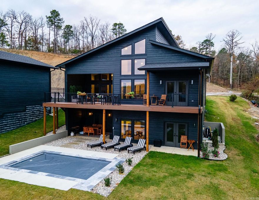 Discover the perfect blend of luxury and opportunity with this stunning 7-bedroom lakefront home. Featuring a private pool, boat slip, and breathtaking water views, this property offers endless possibilities as a permanent residence, a second home, or a lucrative Airbnb investment. Whether you're looking for a serene retreat or an income-generating property, this home delivers on every front. Its spacious design and upscale amenities make it ideal for hosting vacationers, family gatherings, or enjoying peaceful lakefront living. The seller is also offering flexible owner financing, making this incredible opportunity even more attainable. Don't miss your chance to own a piece of lakefront paradise in Hot Springs!
