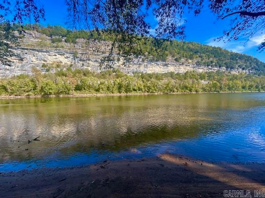 Discover over 26 beautiful acres in the heart of the Ozarks-an incredible opportunity for investment,recreational, or your dream getaway!This unique property features multiple lots, including a 1.5 acre lot on the White River with underground power, water, and septic already in place. All additional lots are equipped with under ground power already there and water access. There is already even fiber internet if you need it. This property offers flexibility for future homesites or development.Enjoy private access to the White River for fishing, floating, and relaxing, with a public boat ramp just a couple of minutes away. Take in the stunning mountain and river views that make this area so special. Located near Mountain View, Arkansas known as The Folk Music Capital of the World. You could spend your days catching record trout and your evenings dining at local restaurants and enjoying live music on the courthouse square. Whether your seeking an investment,a peaceful retreat, or a base for outdoor adventures, this property offers unmatched natural beauty and endless potential in one of the most scenic areas of the Ozarks. Camper pictured does not convey. Lots are being sold together.