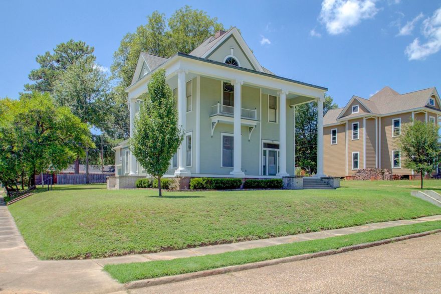 Listed on the National Register of Historic Places, 1005 Pecan St. is a 4-bed, 3-bath masterpiece built in 1900, seamlessly blending historic charm with modern conveniences. Enter through a front door into a warm, 12' ceiling space with original hardwood floors. The chef's dream kitchen boasts granite counters and shaker-style cabinetry. The home offers versatility with 2 living areas, and the formal dining room can serve as a third living space for sophisticated gatherings. Upstairs, 11' ceilings and pine floors create a cozy ambiance. The master bedroom features original light fixtures and an antique claw foot tub in one of the bathrooms. Enjoy warmth on chilly evenings with four fireplaces, three with electric inserts. This residence perfectly balances historic preservation and contemporary living, inviting you to step back in time while enjoying modern comforts. Don't miss the chance to own a meticulously preserved piece of history at 1005 Pecan St. The charming and inviting Carriage House is currently a very profitable Air BnB! Pictures are included of the unit.  Also, EV chargers are also available for the homeowner or the Carriage House guest.