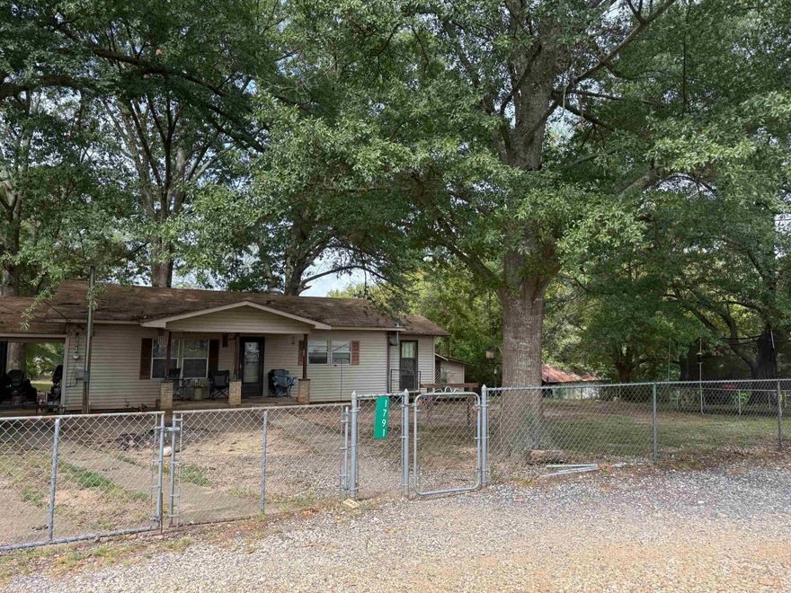 This 2.52 acres includes house and small barn. The property sits in a great location in Rockport, close to all amenities and the I-30 corridor.  It is being sold "as is."  See agent and showing remarks.