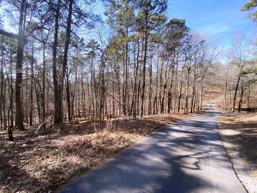 5-acre residential lot with shared gate access on Foxridge Road. Located minutes from the shopping, restaurants, entertainment and highly rated schools of West Little Rock, this acreage features mature trees, a wet weather creek, gentle slopes and potentially two building locations. Previously approved for septic.  AGENTS READ REMARKS FOR INQUIRIES *Gate code needed for access.