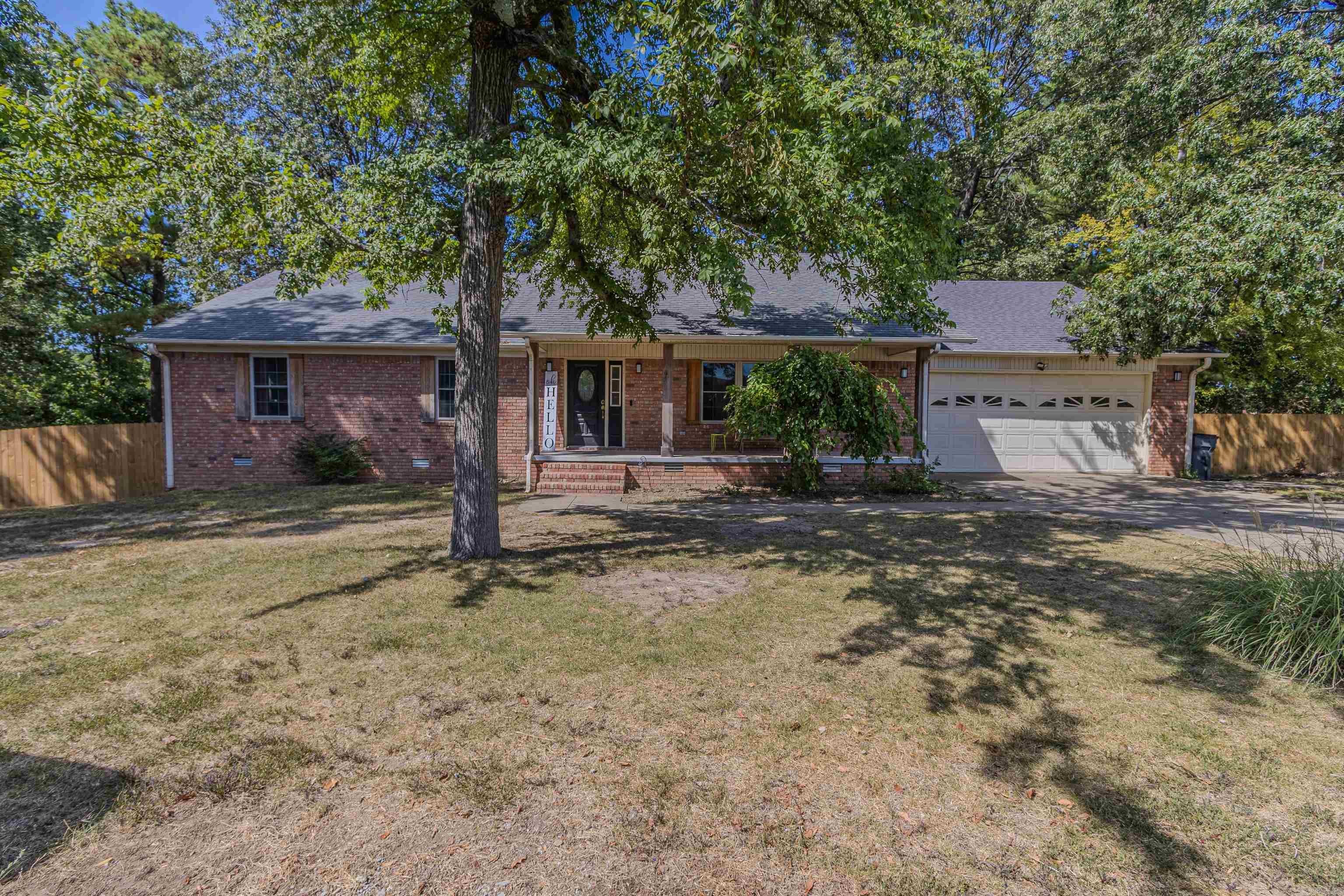 Welcome to this beautifully updated 3-bedroom, 2.5-bath home offering 2,694 sq. ft. of living space on nearly half an acre. Recent upgrades include a brand-new wood privacy fence, updated toilets throughout, and a new HVAC system installed this year. The inviting living room features a newly built shiplap fireplace, while the spacious bonus/sunroom provides endless possibilities for relaxation or entertaining. The large master suite includes a walk-in closet, and the home boasts both a covered front porch and a large wooden deck perfect for grilling or enjoying the outdoors. Conveniently located near local amenities, this property blends comfort, style, and functionality in a prime location.