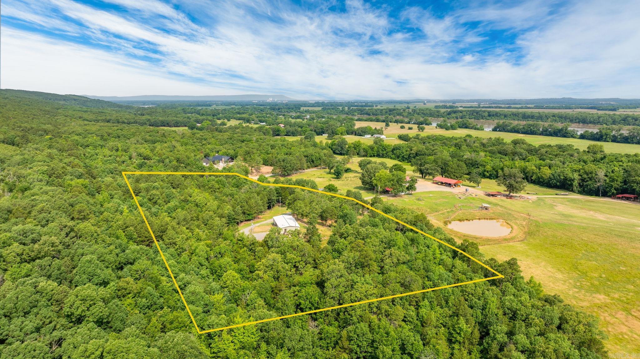 Like-New Home on 4.2 Acres ā Minutes from Conway! Beautifully updated 3-bed, 2-bath home on 4.2 acres in Houston, AR. This open-concept floor plan features split bedrooms, LVP flooring, 8.5' ceilings with wood beams, and a stone fireplace with mounted TV that conveys. The kitchen offers a large island, walk-in pantry, stainless appliances, and a deep farmhouse sink. The spacious primary suite includes back deck access, a soaking tub, dual vanities, an 8' walk-in tile shower, and generous closets. Also, for added convenience this home has separate laundry/mudroom entry. Exterior highlights include a metal roof, wood shutters, LED accent lighting, a composite-covered back porch, and a fenced pet area. Concrete foundation, metal skirting, Peaceful setting just a short drive from Conwayāmove-in ready!