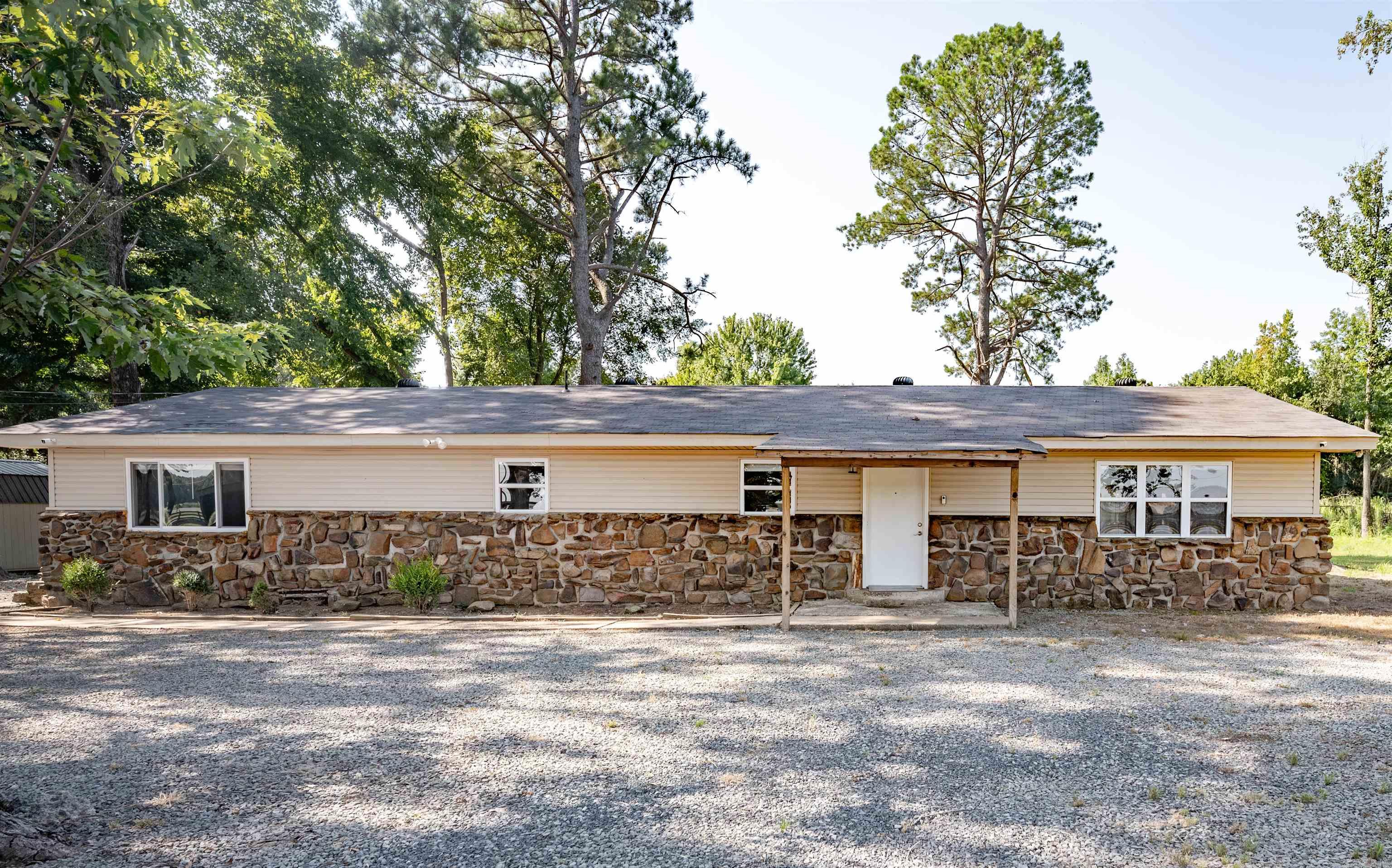 Enjoy the convenience of country living with only minutes to the freeway and Little Rock Air Force Base. The completely remodeled gated home is situated on 4.5 beautiful wooded acres that's fully fenced with plenty of room to start that farm you've always dreamed of having. Recent updates include fresh paint, new windows, HVAC, flooring, new roof, storm shelter, septic, water heater, electrical, light fixtures and stainless steel appliances. This spacious like-new home features 4 bedrooms, 2 bathrooms, a beautiful sunroom and a bonus living space or possible second primary suite. Don't let this one slip away! This property is perfect for you if you love country life but the convenience of the city, being only minutes to shops, restaurants, schools and parks! Call today to schedule your showing! See agent remarks!