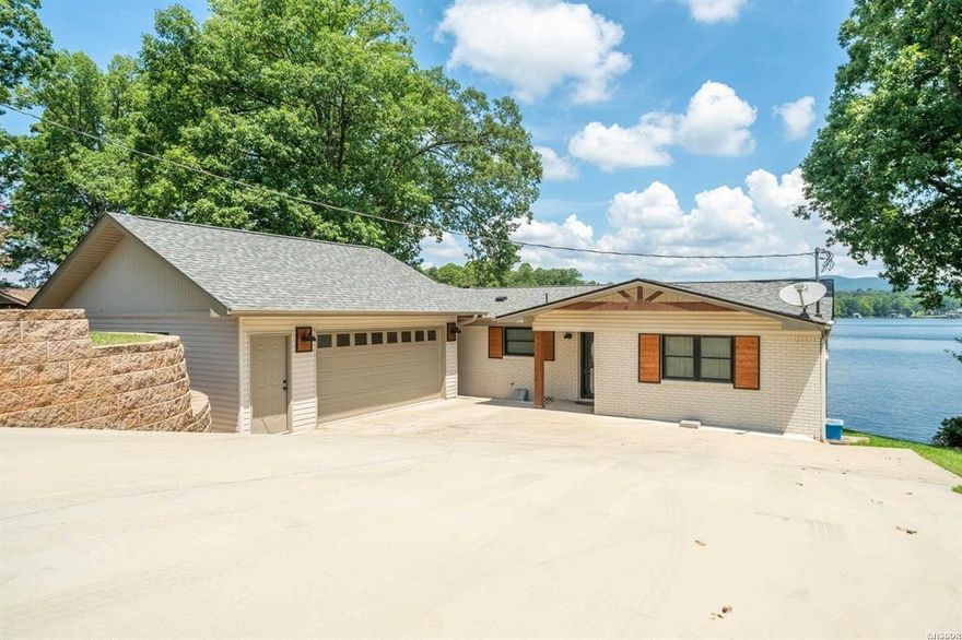 Lakefront 3 Beds / 2 Bath / 1798 Sq. Ft. with lakeside patio and 2 stall boat dock.