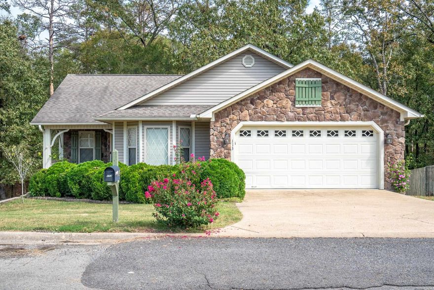 This home is ADORABLE and clean is a whistle. Move in ready 3 bedroom, 2 bath home waiting for new owners & new memories. On the back side of the home you will find a full basement, current owner currently utilizes the space for yard tools.  Luxury vinyl flooring through out and tile flooring in the kitchen. One of the highlights of this property is the outdoor space. Step out onto the back patio, where you'll find a tranquil retreat surrounded by whispering oaks. It's the perfect spot for morning coffee, outdoor dining, or simply unwinding after a long day. This home is situated in a quiet cul-de-sac, ensuring privacy and peace. Located in Lakeside school district.  Hot Springs area offers so many activities for the entire family to enjoy.  Call/text today to make this home your very own beautiful space.