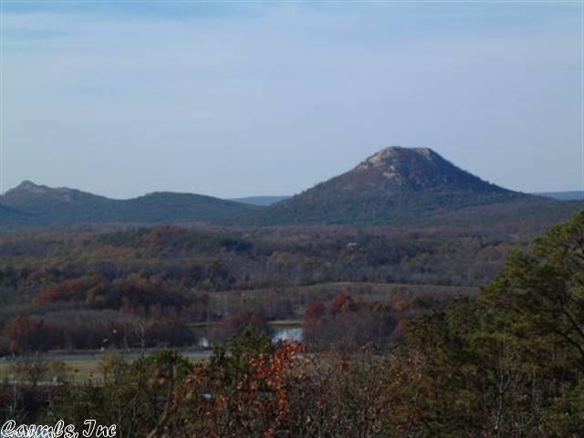 Sloping and wooded. View of the AR River. Gated area with high tech security system. POA dues $70.00 per month, per lot. One time fee of $1,000 per lot for future road repair. 5 acre tracts in the city with all utilities. Some have fabulous river views. Some lots need pump for sewer. See showing remarks. Gated area. Taxes to follow