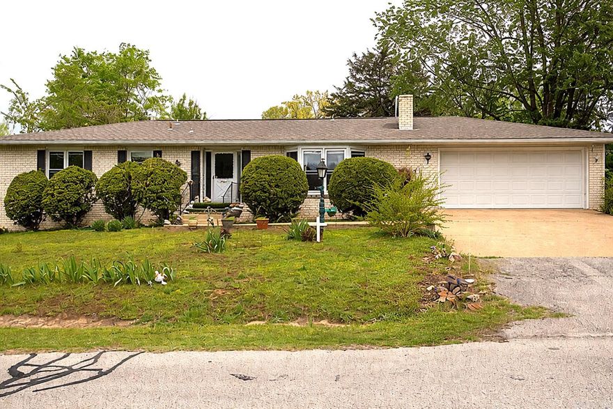 Charming 3-bedroom, 2-bath home located in town with a warm inviting feel. This well-maintained property features a cozy wood-burning fireplace, perfect for relaxing evenings, and a spacious glassed-in back porch ideal for year round enjoyment. The level yard offers easy up keep and plenty of outdoor space, complemented by a 2-car attached garage. The kitchen shines with all new stainless-steel appliances, while recent updates include a newer roof and updated HVAC system for added peace of mind. It is conveniently located less than a mile from the city park, medical center, shopping plus just minutes to Lake Norfork, this home blends comfort, convenience, and character with just the right touch of vintage charm.