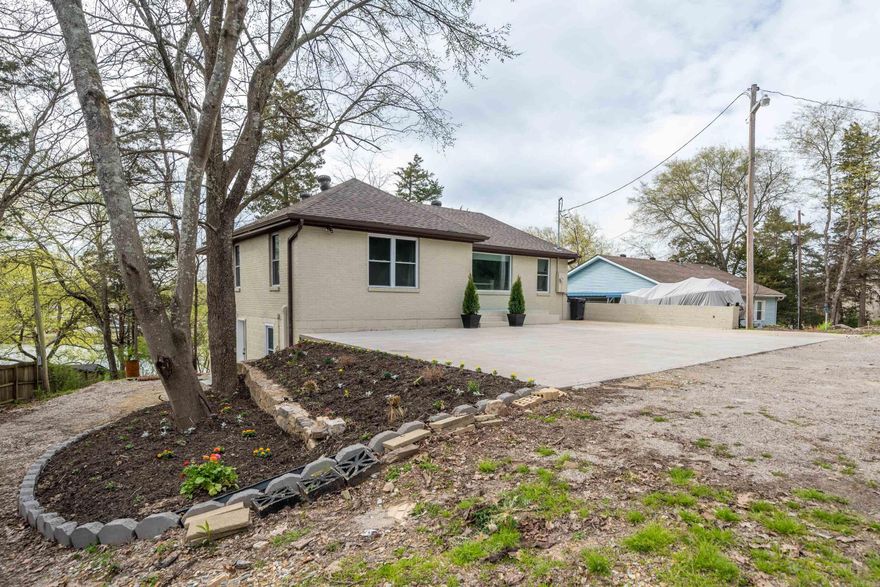 207 Ledgerock Rd...Lake Hamilton waterfront home…Boat dock permit is included...POSSIBLE OWNER FINANCING...Nightly Rental Potential...Up to 5 bedrooms 2 Baths Over 2,400 SF Convenient to Numerous Attractions - Go cart track, Miniature Golf, Bumper Boats and much more...Sunroom overlooking Lake Hamilton...Amazing updates...Modern lighting and fixtures throughout...2 Living areas on separate levels...Outdoor living areas...Plenty of parking...Owner may consider trades..SEE AGENT REMARKS