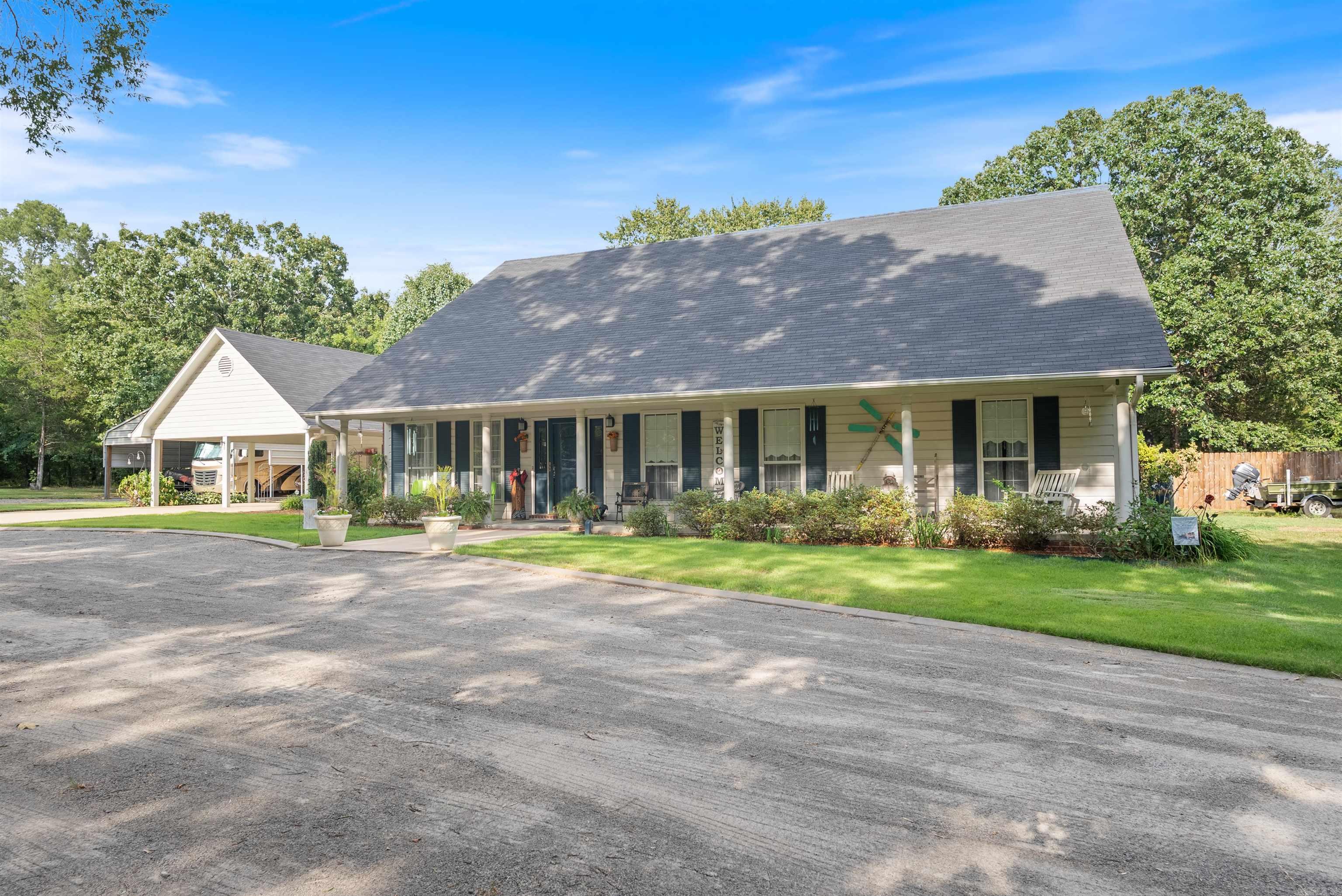 Welcome to your private retreat in the heart of Greenbrier! This beautifully maintained 3 bedroom, 2 bath home sits on nearly 1.5 acres, offering space, and functionality at every turn. Inside, you'll find a warm and inviting layout featuring a cozy sitting room just off the kitchen, and a living room centered around a beautiful wood-burning stove fireplace, perfect for relaxing evenings and gatherings." Enjoy the convenience of multiple outdoor storage sheds, a cozy greenhouse for your green thumb, and a heated & cooled bonus room above the carport ideal for a home office, hobby space, or guest retreat. For the outdoor enthusiast or hobbyist, this property also boasts a massive RV storage with two bays, complete with 50, 30, and 110-amp hookups, and an 8-ft storage room for all your tools and gear. Plus, there's even a dedicated spot for your bass boat! Just hook up and head out to the lake! Whether you're looking for a homestead, workshop-ready property, or space to grow and explore, this one has it all. Don't miss the chance to make this slice of Greenbrier yours!