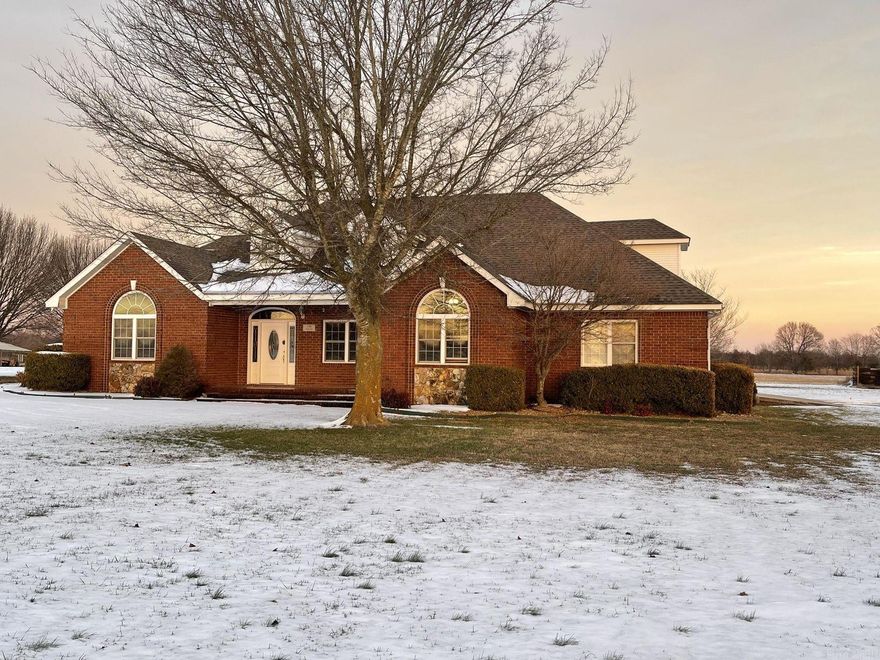 Country living at its finest with this custom built brick home on 4 acres. Home features large rooms with split floor plan, primary suite with jetted tub and 2 walk in closets, 3 other bedrooms on the main level, custom kitchen with granite countertops and lots of storage, dining room, large vaulted ceiling in living area which opens onto a covered patio for outdoor living, dedicated laundry, half bath all on the main level. Upstairs has bedroom, full bath, and several bonus areas which could be used for an additional bedroom with its own living area that opens onto a back raised deck with great views. House also features a large double garage, storage shed, and a outdoor shooting berm. Some of the updates are new roof, HVAC, door, appliances and is wired for a whole house generator.