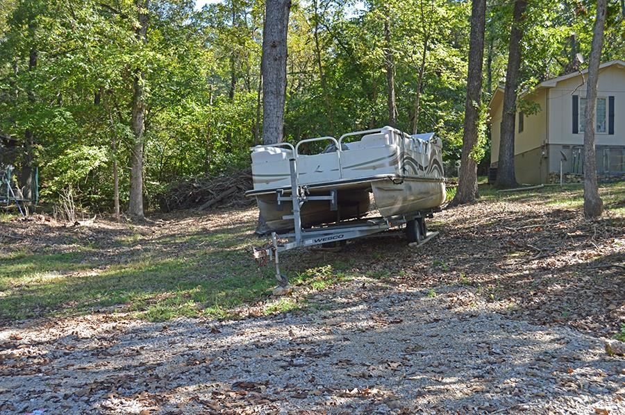 This is a lot across the street from a home for sale, it can be bought with the home or you can by the lot as is. Across the street from Lake Sequoyah. Cleared lot with a slight up slope good view of the lake.