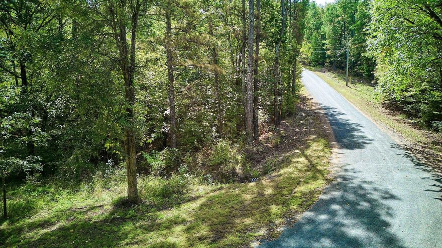 Discover the perfect blend of privacy, natural beauty, and convenience on Lot 16 of Lake Catherine Lake View Estates. This 2-acre lake-view property with lake access offers the ideal homesite for buyers seeking space, scenery, and location within the Lakeside School District. The property features road frontage on Tall Hickory Road, utilities available at the street, and gently rolling topography suited for a custom home or weekend retreat. Enjoy serene views, quick access to Lake Catherine, and proximity to shopping, dining, and outdoor recreation. Whether you’re ready to build now or invest for the future, this lot provides an exceptional opportunity to own acreage in one of Hot Springs’ most desirable settings.