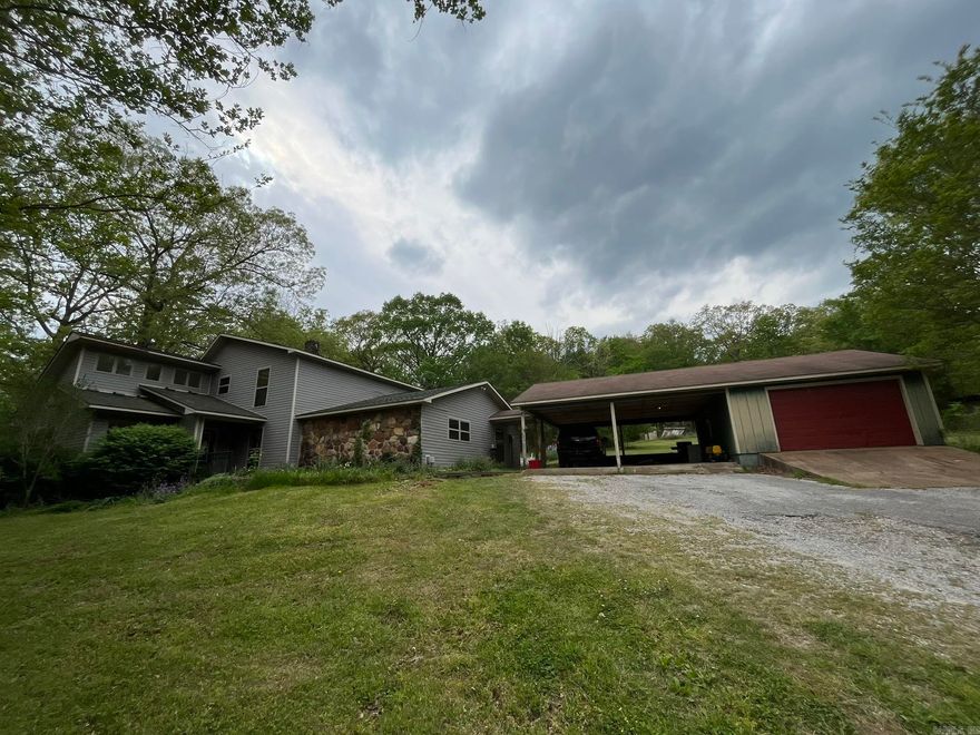 Beautiful, quiet setting with 4 acres that's close to town. Beautiful landscaping surrounds the property. Huge den with Gas Log fireplace. In-ground swimming pool and plenty of room for a garden. Double car port and single garage.