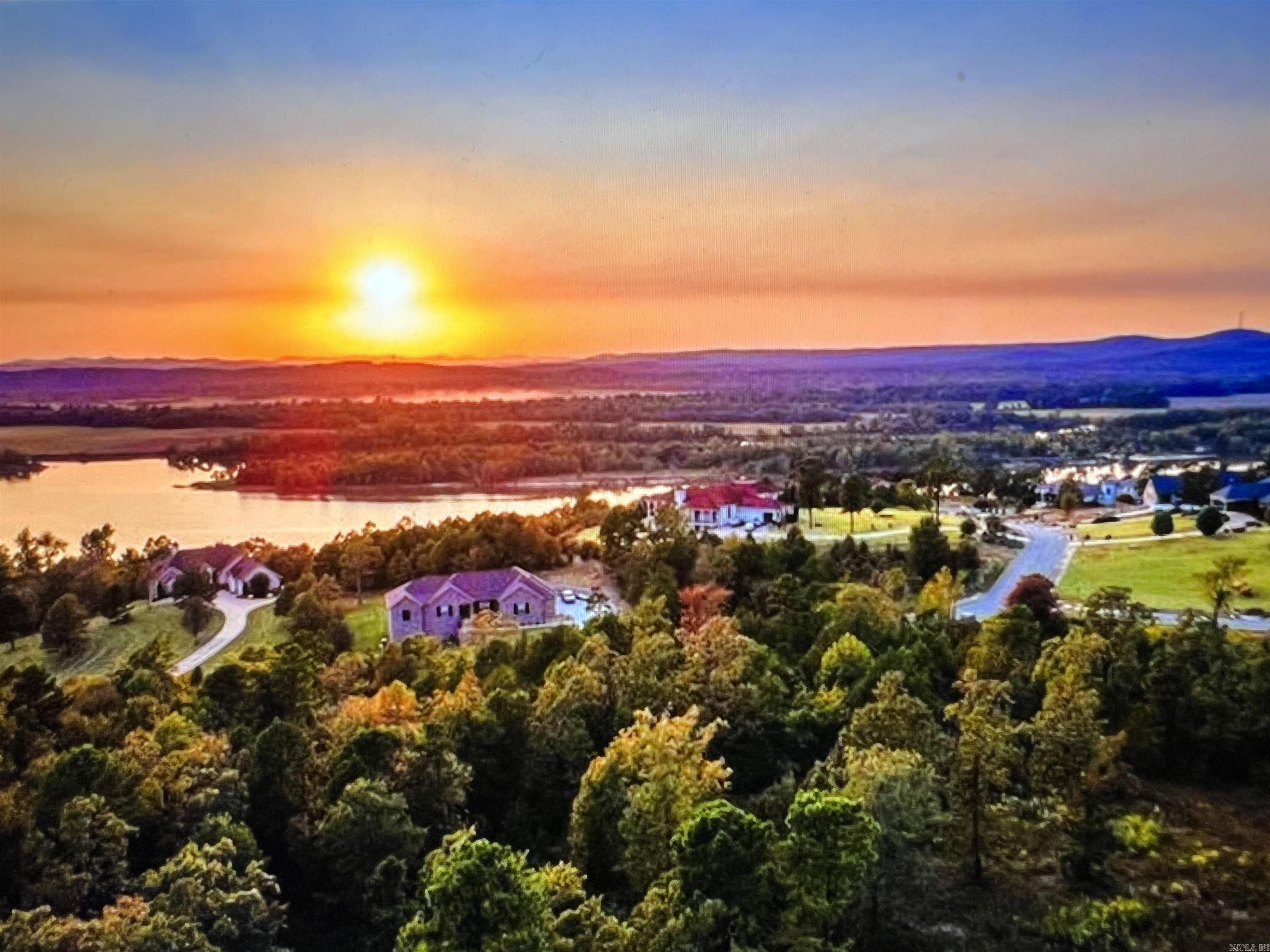 One of Maumelle's most sought after Gated Communities! Spectacular views of the Ar River and Pinnacle Mountain with Breathtaking Sunsets!! This is one of the larger lots, level so it will be easy to build on and probably the most private lot. Why not wake up every morning with some of the most impressive views in Arkansas. Have you always wanted to design your own home? Let me help you make that dream a reality! Underground utilities to include; water, electricity, gas, sewer and high speed ATT internet! Minimum sq ft requirements are 2500 sq ft. Gates are open on Sat and Sun from 1-4.