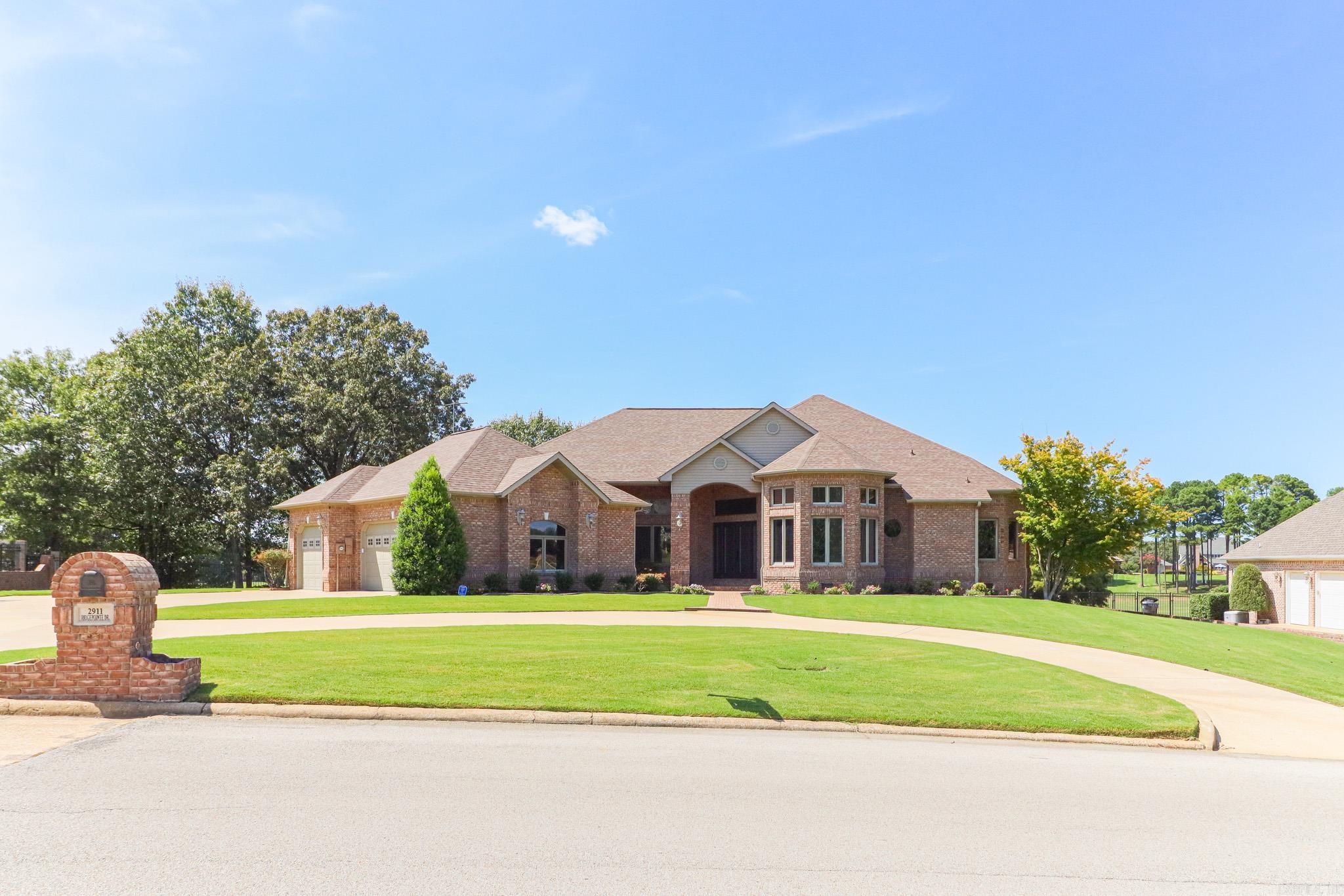 This stunning all-brick home, has been completely remodeled to perfection, offering a blend of classic charm and modern luxury. Situated on just over an acre of land, the property boasts expansive views of a lush golf course, which can be enjoyed from the large back porch an ideal space for relaxing or entertaining. Inside, the home features soaring 12-foot ceilings throughout, creating an open and airy atmosphere in every room. The layout includes two spacious living areas, providing ample space for both family gatherings and more intimate settings. A large office offers a quiet retreat for work or study, while the elegant design ensures comfort and functionality in every corner. With 3 cozy fireplaces placed strategically throughout the home, the space exudes warmth and ambiance. The home has three generously-sized bedrooms, including a luxurious master suite with an en-suite bath. The 2.5 bathrooms are beautifully appointed, with high-end finishes and modern fixtures. For added convenience, the home comes with a 3-car garage and an in-ground storm shelter, providing peace of mind during unpredictable weather. This residence offers the perfect blend of style, space, and security.