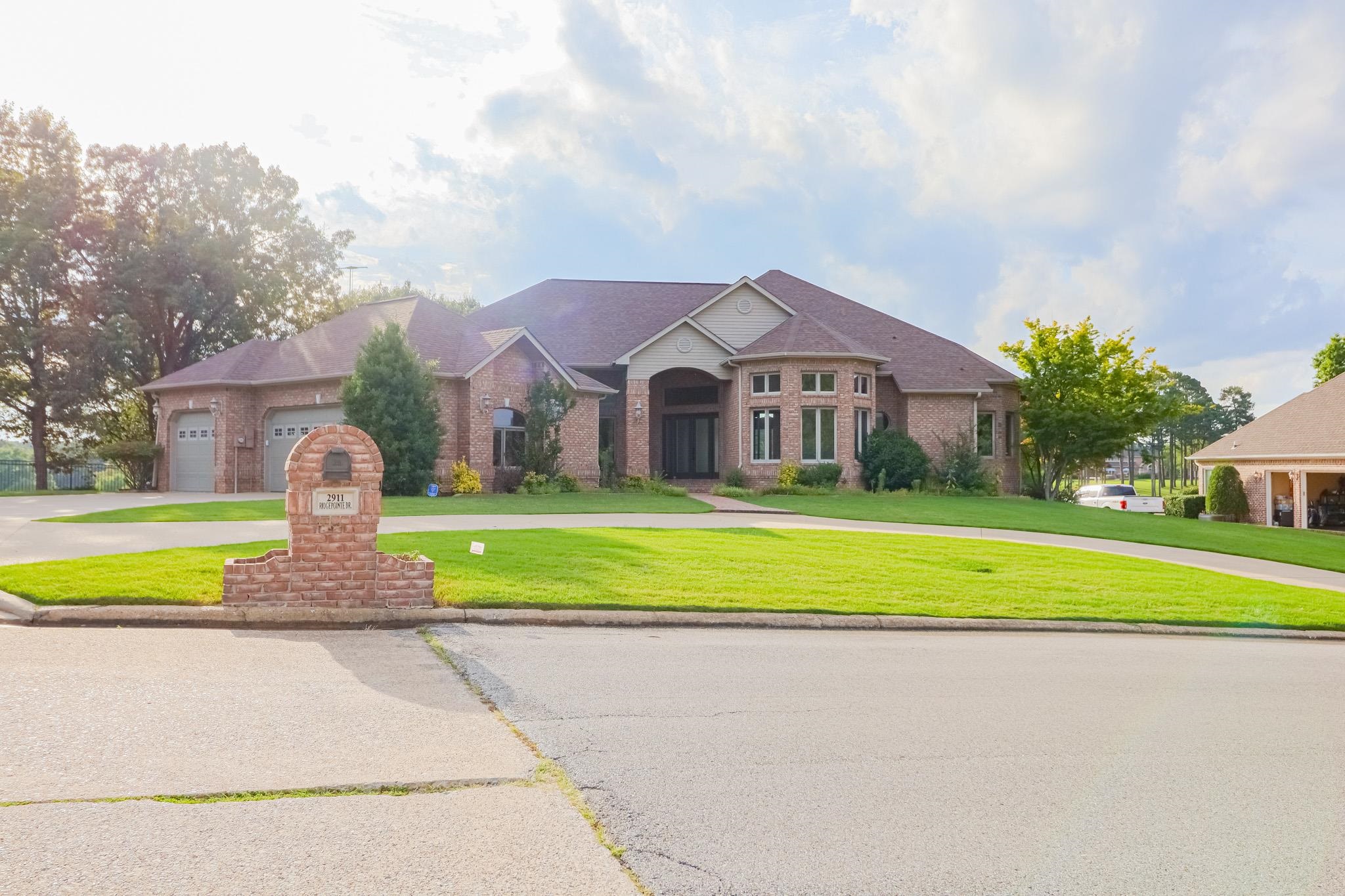 This stunning all-brick home, has been completely remodeled to perfection, offering a blend of classic charm and modern luxury. Situated on just over an acre of land, the property boasts expansive views of a lush golf course, which can be enjoyed from the large back porch an ideal space for relaxing or entertaining. Inside, the home features soaring 12-foot ceilings throughout, creating an open and airy atmosphere in every room. The layout includes two spacious living areas, providing ample space for both family gatherings and more intimate settings. A large office offers a quiet retreat for work or study, while the elegant design ensures comfort and functionality in every corner. With 3 cozy fireplaces placed strategically throughout the home, the space exudes warmth and ambiance. The home has three generously-sized bedrooms, including a luxurious master suite with an en-suite bath. The 2.5 bathrooms are beautifully appointed, with high-end finishes and modern fixtures. For added convenience, the home comes with a 3-car garage and an in-ground storm shelter, providing peace of mind during unpredictable weather. This residence offers the perfect blend of style, space, and security.