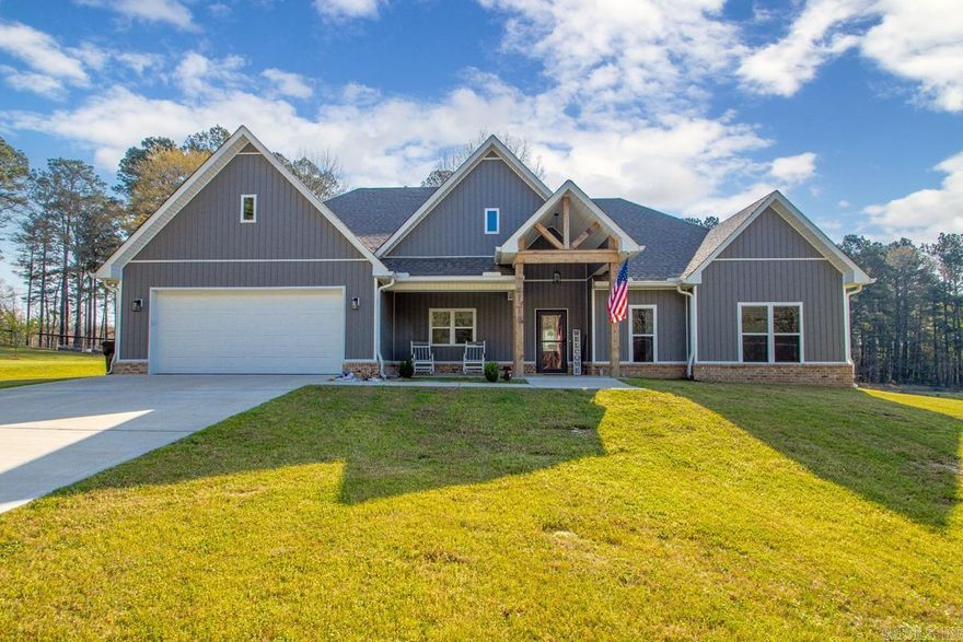 Check out this beautiful Craftsman-style home out in the country! This 4 bed, 2.5 bath home sits on 2.50 acres and features a mix of brick and siding with custom cabinets and granite throughout, plus a separate laundry room. The primary suite has 11 ft ceilings and a gorgeous bathroom with a separate shower and tub, tile surround, and dual vanities. The living room also has 11 ft ceilings with gas logs and flows right into the open floor plan. The kitchen is perfect for cooking and entertaining, with a big granite island that can double as a workspace. Secondary bedrooms are a great size and share a dual bathroom setup. Enjoy both front and back porches, all tucked away on a quiet, private dead-end road—perfect for country living!