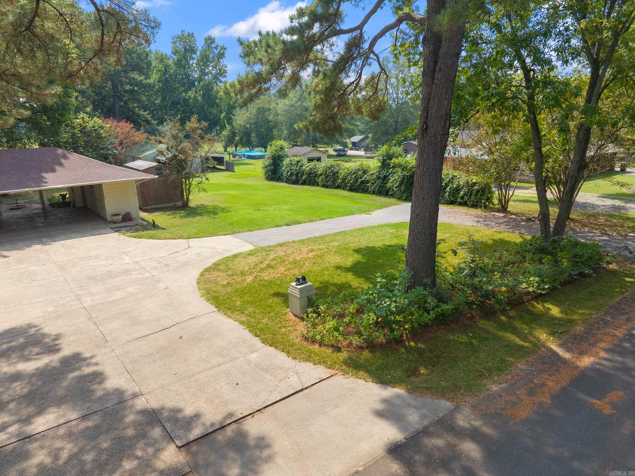This beautiful 2101 square foot home offers a blend of classic character and modern updates. Built in 1978, the property has been thoughtfully maintained and improved with major updates, in including a new roof (2022) and a new HVAC system (2022). The kitchen is enhanced with a refrigerator that's just a year and a half year old. Inside, you'll find charming details such as pocket doors, a bay window, and vaulted ceilings in the great room, adding both charm and spaciousness. The wood floors and storm doors further complement the home's inviting design. Home sold as is. The property sits on nearly a full acre (.92 acres) and offers exceptional outdoor amenities. A large 35' x 40' shop with power, metal roof, and metal siding provides ample space for hobbies, storage, or work. The shop also includes a lean-to with concrete slab floors for additional functionality. An Active well on the property adds future value and independence. This home combines comfort, space, and utility--making a standout opportunity. (Agents! See Confidential remarks)