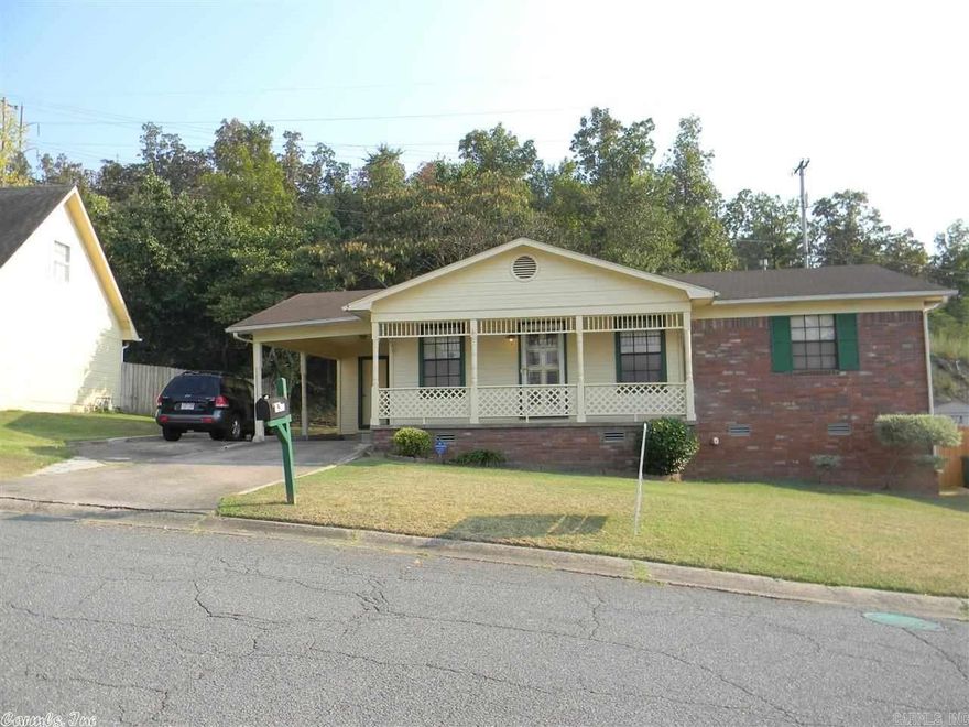 NEW PRICE!!!  NEW CARPET OCT.2014. NEW HW heater 2014.  NEW INT.& EXT. Paint in 2012 & 2013. NEW Ceramic Tile in Hall Bath 2011, Kitchen Tile in 2012. Refrigerator to Convey.   Roof Inspected 2014 & NEW Flashings Installed. Separate Laundry Room. One Car Carport & Extra Parking Pad. Relaxing Front Porch. No Neighbors in Back, Just Cool breezes from the trees in back.   Security System.  SECURITY CODE NEEDED