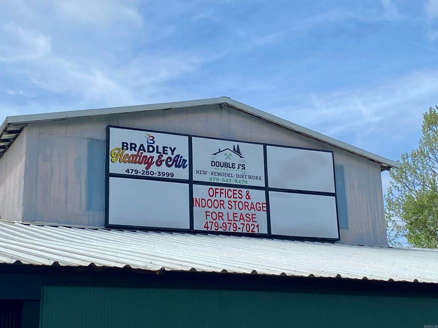 Massive Industrial Zoned Facility located on US Hwy 64/Hwy 21 Junction in Clarksville, AR.  Over 40,000 sq.ft. includes a newly remodeled 1,980 sq.ft. office w/ multiple spaces, conference room, kitchenette, restroom, & lobby (new HVAC, plumbing, electrical, insulation).  The majority of the space is open allowing for multiple uses.  Approx. 1000 feet of Hwy frontage.  Highly visible!  7,400-9,900 daily traffic count!  Established gravel lot w/ access to drive around the building fully.  6 new box signs installed ($10,000).  See photos of survey, traffic counts, building dimensions.