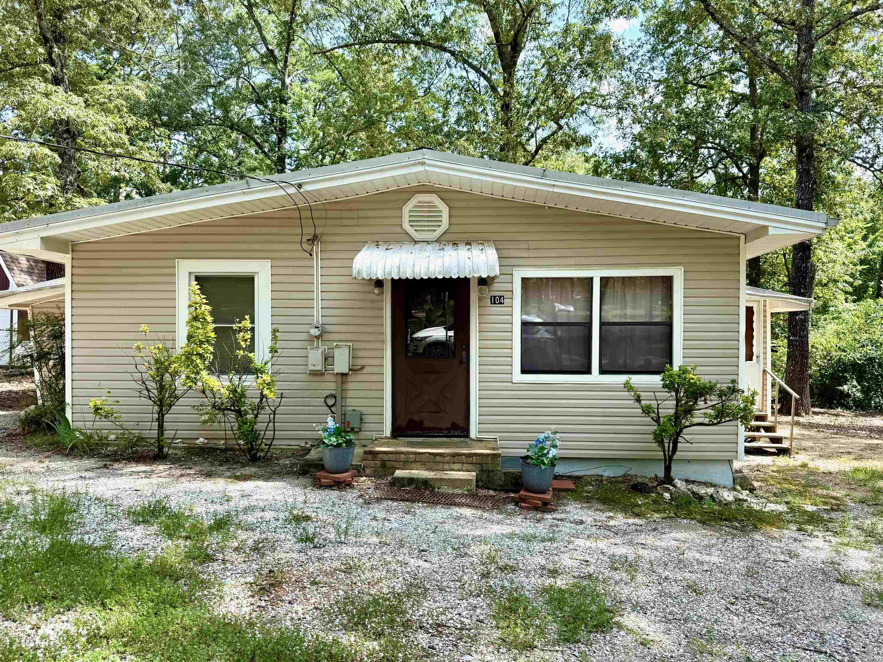LOOKING FOR A LAKE ESCAPE without breaking the bank? This 3-bedroom, 1-bath cabin-style home is tucked away in the countryside, just four minutes from Rabbit Trail boat launch on Lake Ouachita, one of the best public access points in the area with no boat fee. Close to Buckville Recreation Area and a shooting range. Just a short distance from thousands of acres of prime public hunting land too. Set on a peaceful lot, this getaway spot features: - A spacious kitchen - Window AC units + gas wall heat - 13 x 18 covered carport - Outbuilding and a shop for your lake toys or tools - Convenient fish cleaning station Whether you’re looking for a weekend fishing camp, an STR investment, a cozy family home, or a low-maintenance getaway near the lake, this place gives you that rustic, laid-back feel in a location hard to beat. COME AND SEE! Agents - Call Showing service to schedule all showings.