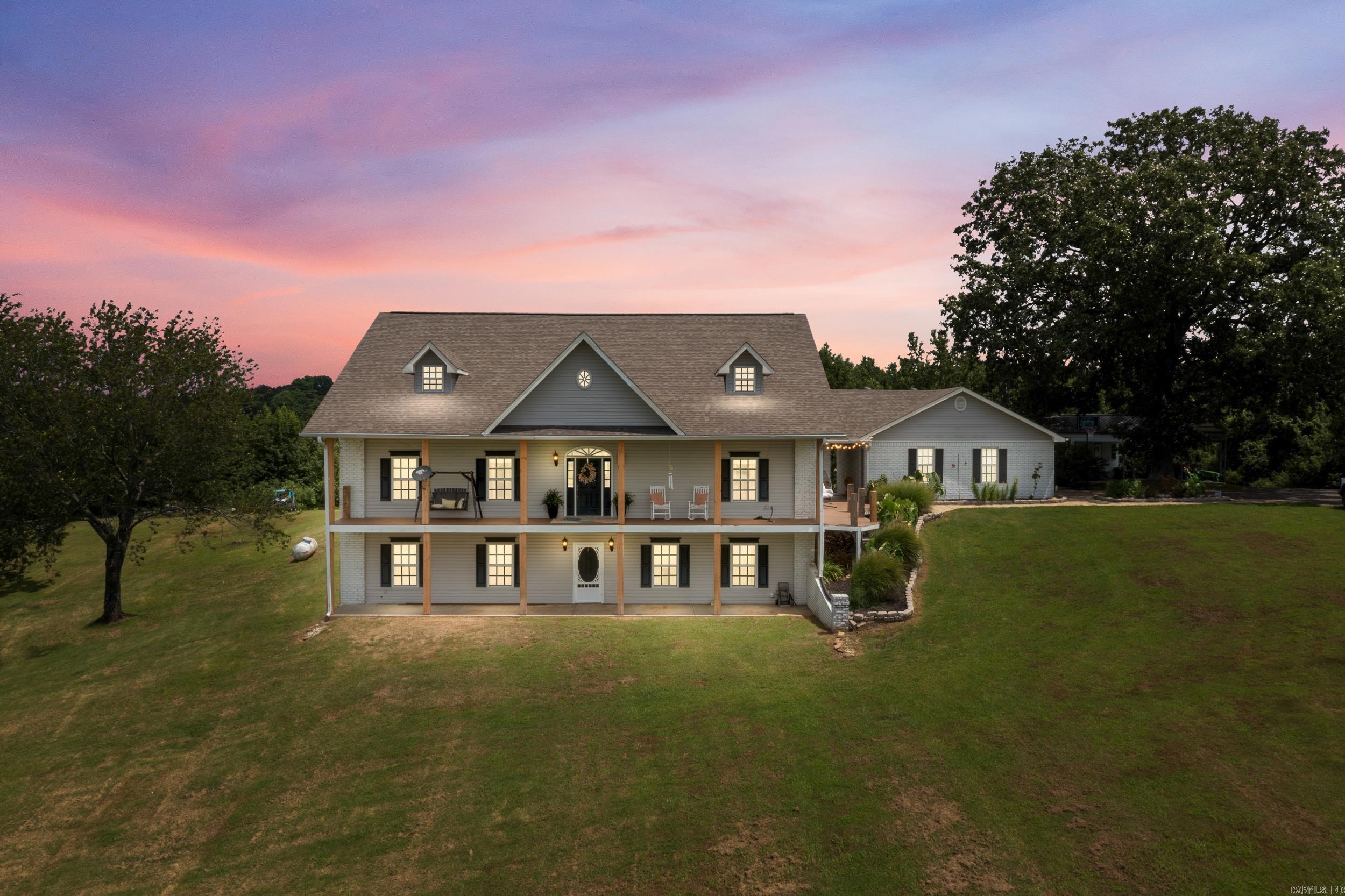 Reduced! Absolute BEST view from Crowley's Ridge in Cross County! This Sprawling 12.05 acre estate has it all! Beautiful custom home perched perfectly overlooking the large pond and wrapped with a two story covered porch is the perfect place to watch Delta sunsets! Entering the home you are greeted by a foyer area opening up to the family room and with views directly out to the brand new in-ground pool complete with custom stone outdoor fireplace! Back inside, the main floor consist of a large formal dining room, spacious kitchen with stone counters, nice appliances, ample cabinetry, and breakfast area! The large Primary bedroom and on-suite are well designed spacious with a modern farmhouse vibe! Also on this floor is a great guest room and additional full bathroom. Upstairs, you're greeted by a newly renovated and expansive space with a great theatre/sitting room, bedroom and full bathroom all wrapped in beautiful wood! Downstairs, another hang-out space, guest room and full bath along with a great safe room! SO MANY updates have recently been completed, fresh paint, new fixtures throughout, roof, decking and railing replaced, appliances, and so much more! Stunning Property!