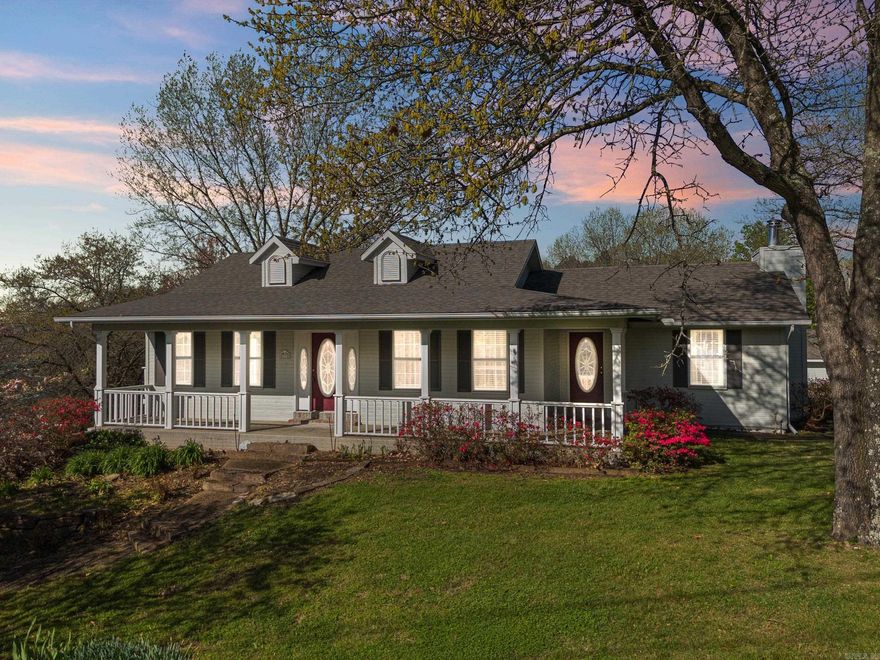 Embrace a private country lifestyle while still being conveniently located to shopping and entertainment with this gorgeous home nestled on 2.31 acres of lush landscaping that offers a blackberry patch, three cherry trees, two pecan trees, and an abundance of dogwoods. The main floor features a spacious master bedroom with a walk-in closet and an en suite bathroom. The open kitchen/living area allows you to cook while staying engaged with the living space. An adjoining formal dining room can easily convert to an office or additional sitting area. Step outside the kitchen to a charming covered porch, perfect for savoring your morning coffee while soaking in the peaceful sounds of nature. A haven for garden lovers with ample space for gardening! The lower level offers three more bedrooms, a full bath, a large family room, and an office/play area. The oversized two-car garage provides ample space for vehicles and storage. Additionally, there's a separate 30 x 20 shop, insulated for year-round comfort, ideal for any craftsman's dream. House and shop have brand new roof!  Ask your realtor about the $7K allowance to allow you to customize flooring and paint!