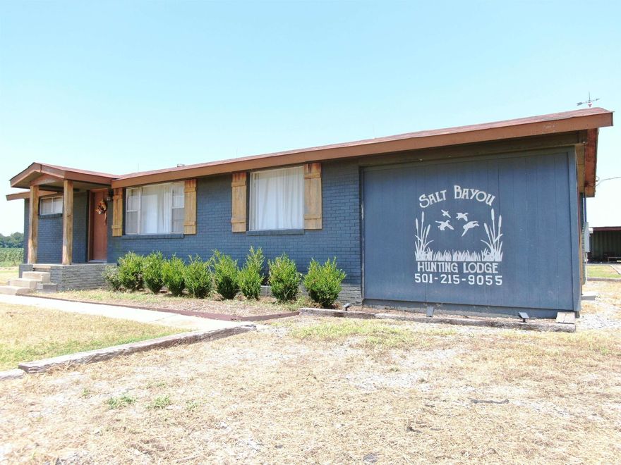 PROFITABLE +/- 20 acre, Airbnb Style Commercial Hunting Property for sale in Lonoke County. Included in the purchase of this property is one, fully furnished, recently remodeled hunting lodge, one conex shipping container sheds, boat, decoys, multiple duck blinds and food plots! Also included is a 3.3 acre CRP payment of $322 annually till 2032. Motivated Seller