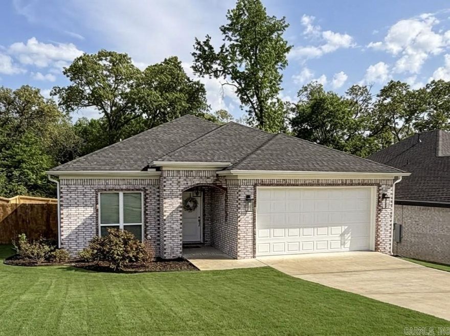 Welcome to this beautifully maintained all-brick home in the highly sought-after Village East subdivision, where comfort, style, and convenience come together effortlessly. Built just 4 years ago, this thoughtfully designed 3-bedroom, 2 bath home offers a bright, open-concept layout with soaring ceilings and abundant natural light. The main living spaces feature durable wood-look tile flooring throughout, completely carpet-free for a clean, modern feel. The kitchen is both functional and elegant featuring quartz countertops, a spacious pantry, and a large bar area perfect for casual dining or entertaining. A separate dining space or flex room provides the ideal setup for a home office, formal dining area, or additional living space. Enjoy quiet mornings or relaxing evenings on the large covered back porch overlooking a fully fenced backyard complete with mature trees for added privacy, an ideal retreat right at home. Additional highlights include: - Refrigerator, washer, and dryer - Spacious primary suite with well-appointed bathroom - Modern finishes throughout - Located minutes from major highway, offering easy access to LR & LRAFB - Well maintained neighborhood