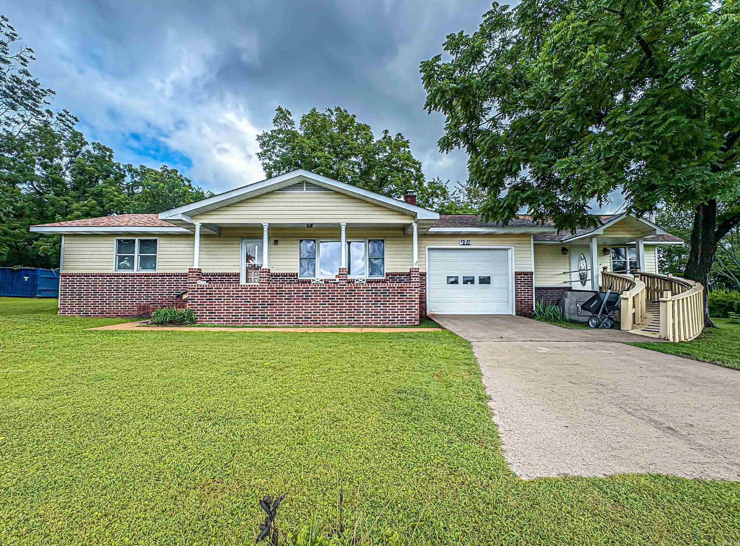 This charming home on the outskirts of town gives you the country feel but allows you to have the close convenience of schools, grocery stores and other needs you may have. This home sits on 1 acre with mature trees, city water and a beautiful yard. There are 3 bedrooms, 3 baths, spacious kitchen and lots of storage. You will also find an additional 765 sq ft building that can be used for hobbies, storage, work area, the possibilities are open.