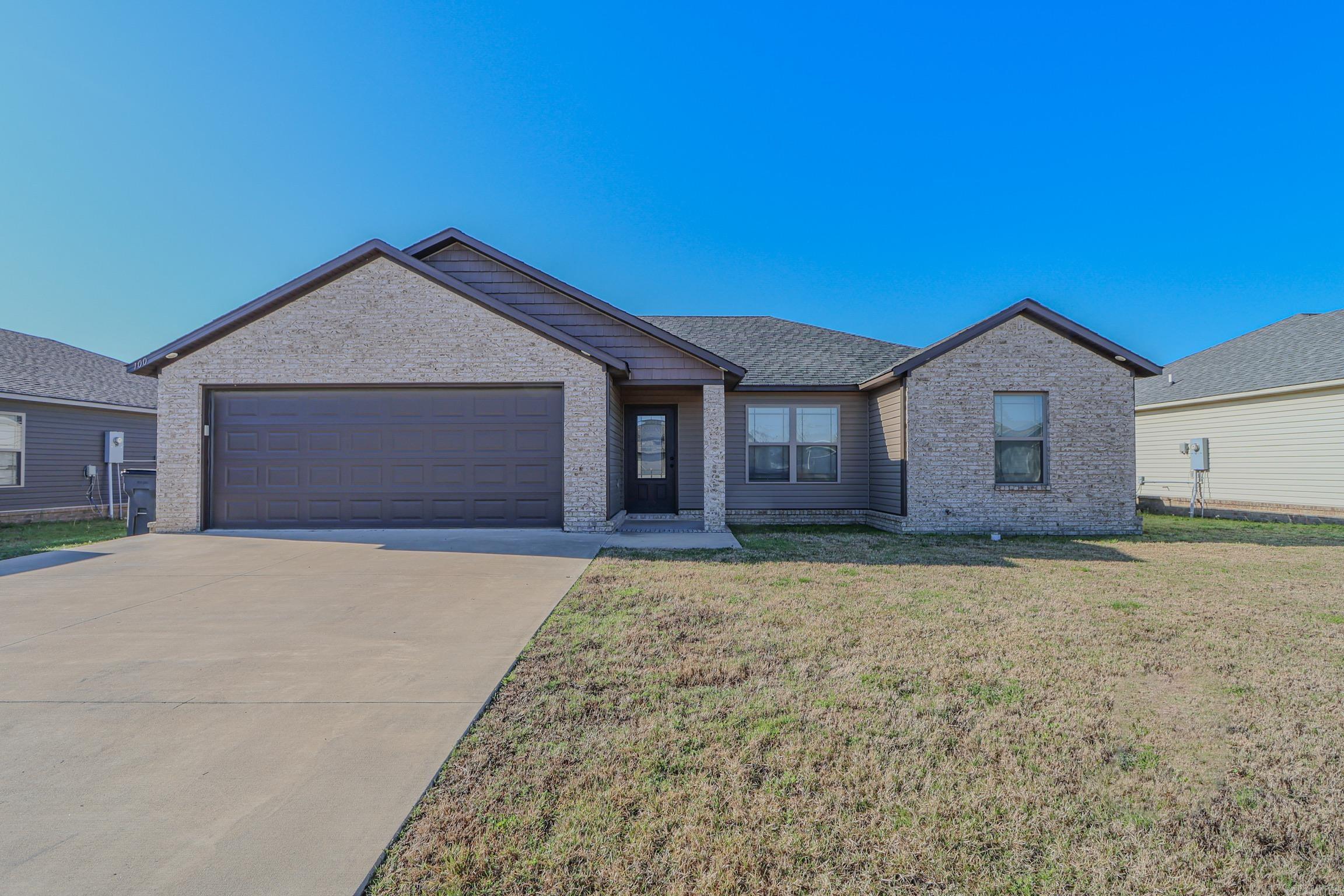 Welcome to the Market, 100 Stacy Dr in Paragould, Arkansas! This immaculately maintained home is only 5 years old but looks like a brand new construction thanks to the owners meticulous care of the property - without the new construction price tag! The home boasts 3 bedrooms, 2 full bathrooms, an open-concept living space for kitchen with custom cabinetry, dining, and living room with vaulted ceilings, and stained concrete floors. The kitchen hosts gorgeous stainless appliances that will convey with the property, as well as plenty of room for dining and a breakfast bar. The large primary suite features tray ceilings, a large dual vanity with custom cabinetry, tiled shower, and generously sized closet. Natural light beams throughout the home creating a warm, cozy, and welcoming space whether you're a homebody or love to entertain. If you enjoy the outdoors, this home has a covered back patio and firepit area within its wood privacy fenced backyard space that is perfect for you! Priced below appraised value, this home is ready for its new owners NOW! Call your favorite agent today to schedule a tour!