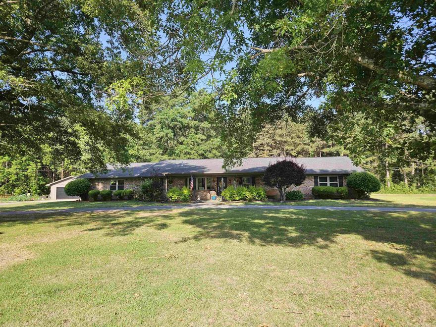 Nestled on 2.21 beautifully landscaped acres, this stunning rural property offers the perfect blend of comfort, space and outdoor living! Built in 1997 and featuring approximately 2,852 sq, this gorgeous home includes 3 bedrooms, 2 full baths, and 2 half baths with an inviting layout designed for both everyday living and entertaining.  Step inside and enjoy the warm welcoming living area highlighted by a beautiful gas log fireplace, formal dining room, spacious den area, and a large kitchen with abundant counter space, dimmer lighting, breakfast bar. The kitchen updates- dishwasher (2018), refrigerator (2022) and gas stove (2023).  The home feature a convenient laundry room/washroom area and large pantry.  Outside, you will fall in love with the backyard oasis that features a fenced inground pool, with liner less than 4 years old, outdoor TV and the Big Green Egg that also remains with the property- perfect for entertaining family and friends. A built-in bug sprayer system around the pool areas help keeps the insect away so you can enjoy your outdoor space comfortably all season long.  Generator, Corner Lot, Detached 2-car garage and so much more. Don't miss out on seeing this one.