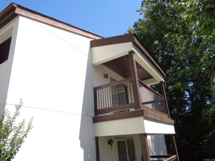 Clean and spacious 2 bedroom 2 bath upstairs unit with a great view. Master bedroom bath is extremely nice.  No pets allowed. Mandatory proof of renter's insurance required. Water service is provided. Tenant pays for own electrical service. Kitchen furnished. Stacked washer/dryer furnished. Must call Access Realty, Inc. at 501-228-0018 to schedule any viewings.