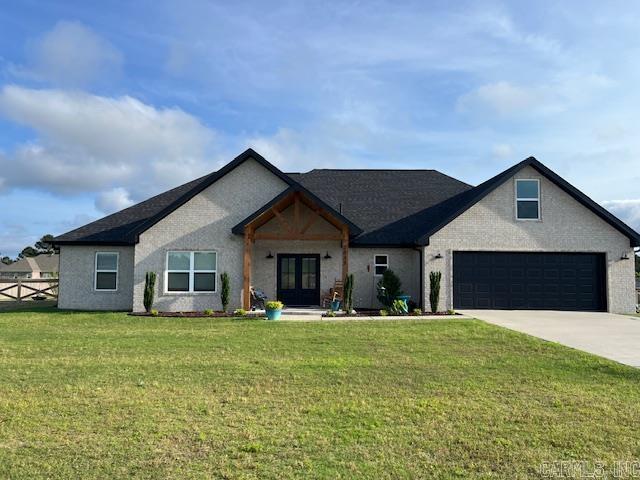Beautiful 4 bed, 2.5 ba home on approx 1 acre lot! Cedar posts along with classic black front doors greet you as you enter this spacious, open floorplan. Plenty of room for the family with 4 bedrooms and 2.5 baths plus bonus or 5th bedroom upstairs. Half bath, huge laundry room, and drop zone are conveniently located at the garage entry so you can keep the mess out of the house! Laundry opens to the master closet! Covered entry and back porch with tongue and groove ceilings. A dreamy open kitchen boasts stainless steel appliances, generous dining nook, coffee bar, and huge pantry! The living room is most inviting with a gas log fireplace and gorgeous picture windows. Master bath has separate vanities, jetted master tub and tiled walk-in shower. Granite countertops throughout. Tons of natural light, large closets and storage throughout this home! This incredible property is only minutes away from banks, dining, shopping, salons, etc, while only 15 minutes to LR. Schedule your showing today!