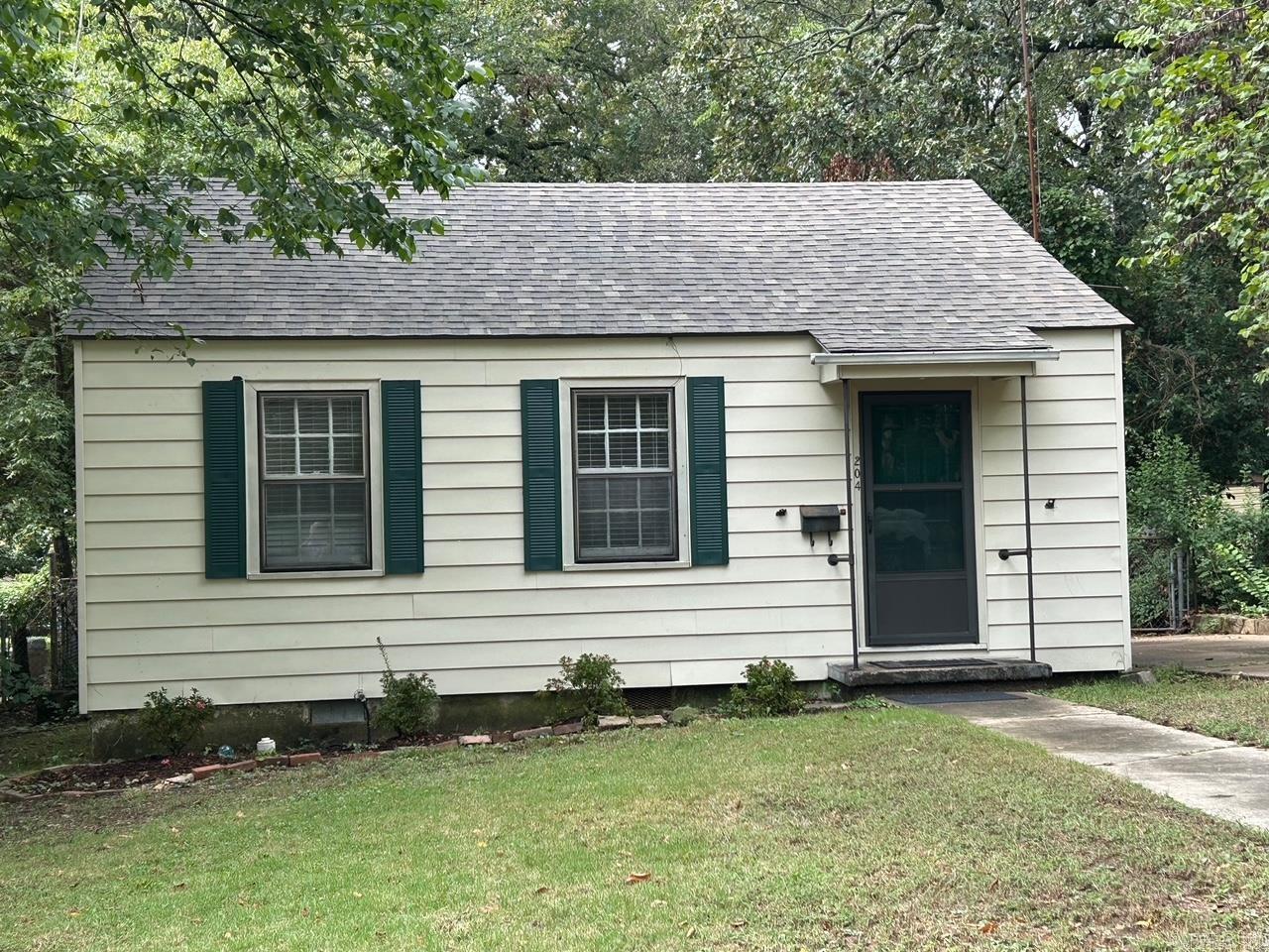 Cozy Hillcrest bungalow convenient to UAMS, St. Vincent & I-630. Two bedrooms one bath. All new paint inside, brand new roof, some new flooring, fixtures and landscaping. Hardwood floors. Level lot and backyard is fenced. Refrigerator & microwave stay. Washer and dryer remain, but condition not guarantied. Level lot and backyard is fenced. Home sold in present condition with right to inspect.