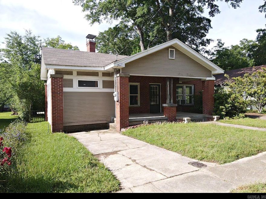 Welcome to this charming 3-bedroom, 1.5-bath home featuring beautiful original hardwood floors and a functional layout perfect for everyday living. A versatile bonus space offers endless possibilities—ideal for a home office, playroom, or additional living area. The kitchen comes fully equipped with all appliances included, along with a washer and dryer—making your move even easier. Step outside to find a detached carport and an additional flexible space that can serve as a garage, workshop, or hobby area to fit your needs. The shop includes space heaters and window units, all of which convey "AS IS". With its blend of character, convenience, and extra workspace, this property offers plenty of potential for homeowners or investors alike.