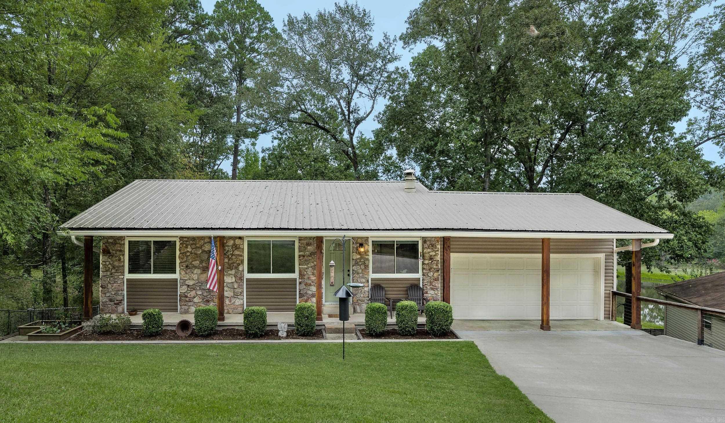Stunningly updated home in the highly sought-after Spring Valley Manor subdivision. This residence has been meticulously renovated, featuring a new gourmet kitchen, new flooring, fresh paint, and updated bathrooms throughout. Enjoy an incredible lifestyle with deeded access to the neighborhood lake, perfect for swimming, paddle boarding, or fishing. All this, just minutes from the heart of West Little Rock, offering the best of community living and city convenience. This is a must-see!