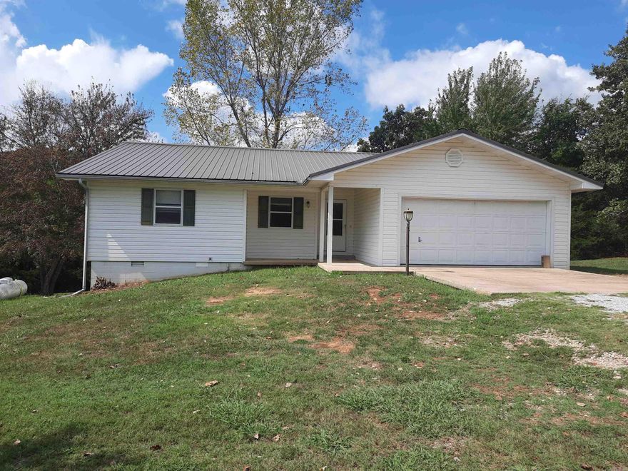 Here is your forever home. 2 bedroom, 2 bathroom with a bonus room/study. 2 car garage. There is a deck that runs along the side and back of the home so you can go out and enjoy nature. Home has a 1/2 basement that can be a game room, storage, extra bedroom or what ever else may suit you. Yard has a fence around one half of it for your animals and room for a garden on the other side. Grocery, restaurant and gas is conveniently right down the road. HVAC is 4 yrs old and roof is 3 yrs old. Has a propane heater in the living room for back-up heat and a 250 gallon propane tank stays.