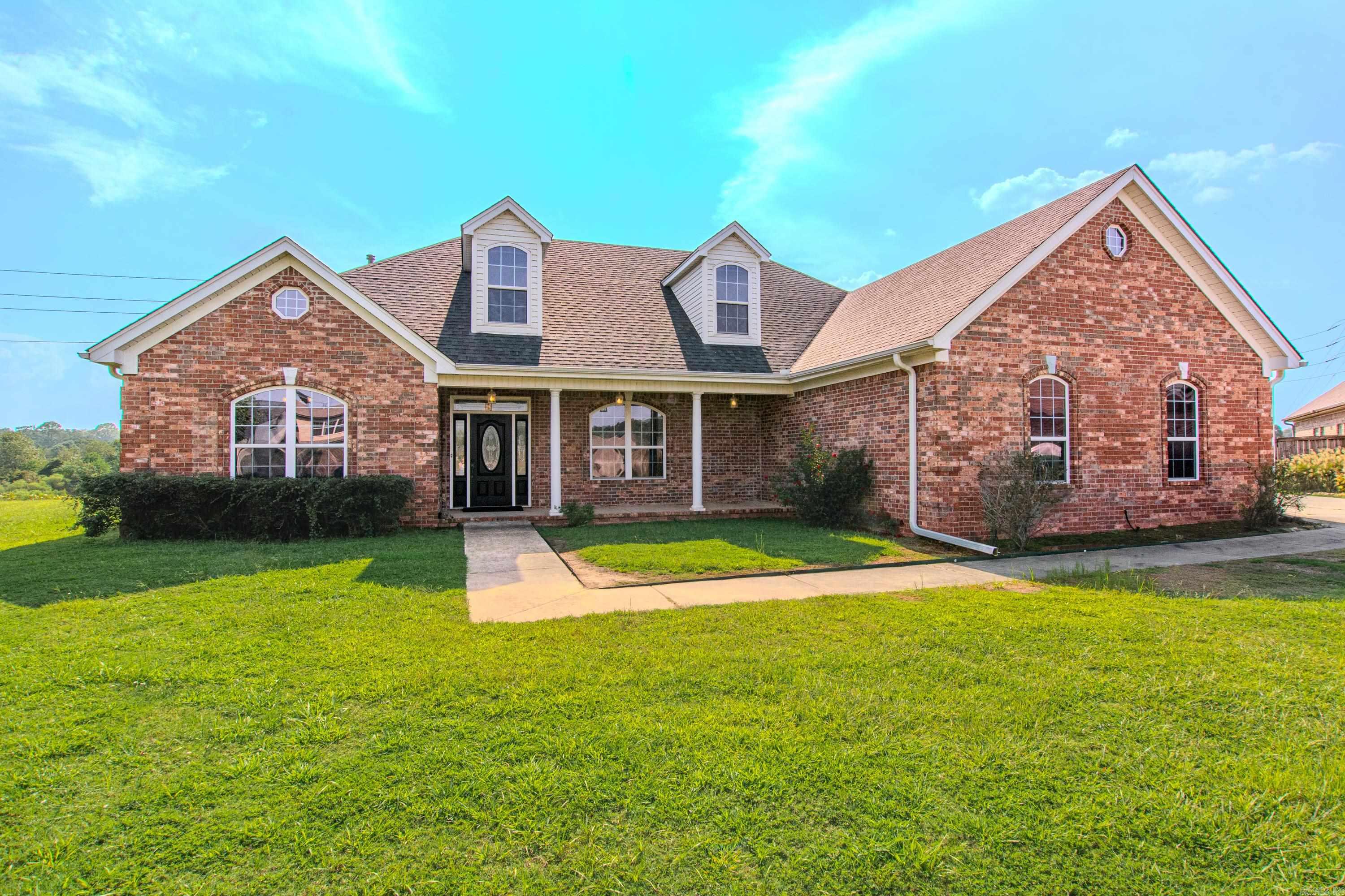 Welcome to this wonderful home right on the lake! This is like two homes in one! This beauty is handicap accessible and has so much to offer! Main floor has three bedrooms, two baths, two living areas, both with fireplaces, formal dining room, chefs kitchen with huge island, lots of custom wood cabinets, desk area, two microwaves and walk-in pantry! Also has heated/cooled sunroom with great view of the lake, so peaceful! The second floor has entrance from first floor and/or from garage, perfect for teen, college student or in-laws! The second floor has full kitchen, dining/living area, bathroom and two bedrooms! Two tankless water heaters, newer roof and generator!