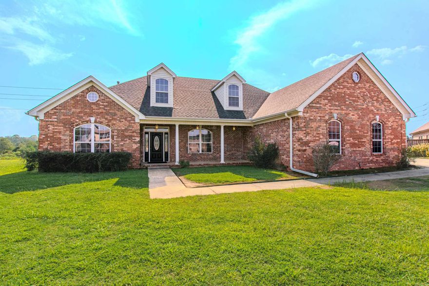 Welcome to this wonderful home right on the lake! This is like two homes in one! This beauty is handicap accessible and has so much to offer! Main floor has three bedrooms, two baths, two living areas, both with fireplaces, formal dining room, chefs kitchen with huge island, lots of custom wood cabinets, desk area, two microwaves and walk-in pantry! Also has heated/cooled sunroom with great view of the lake, so peaceful! The second floor has entrance from first floor and/or from garage, perfect for teen, college student or in-laws! The second floor has full kitchen, dining/living area, bathroom and two bedrooms! Two tankless water heaters, newer roof and generator!