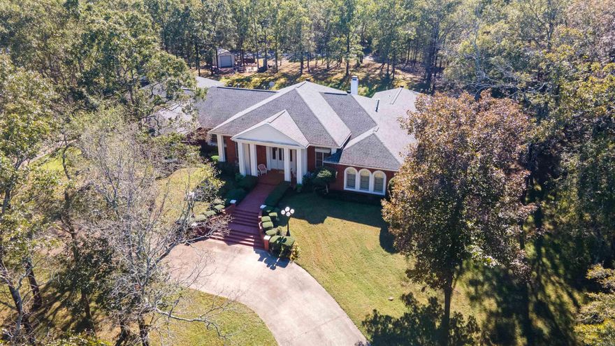 Absolutely stunning elegance with modern charm! Spacious 4963 sq ft home, with open floor plan feeling in Kitchen, dining and living rooms. Beautifully remodeled in 2015, with additional upgrades which include 2 new A.C. units less than a year old! High tray ceilings with prominent crown molding. This home really exudes a wow factor with its beautiful Foyer, Great room, Formal dining Room and Office, Custom Kitchen and Morning Room, 5 bd, 3 ba, 2 half baths, utility room and craft room. Large 3 car garage. Wonderful views of Lake Mena from the front porch and a beautiful brick terrace in the back with lots of space and privacy. The lawn is equipped with a new sprinkler system, beautiful landscaping with ambient lighting and a cozy firepit. This house is a must see that will take your breath away!