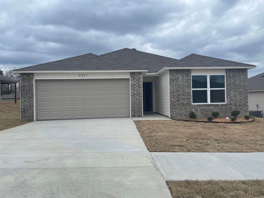 Taylor plan  Upgrades in this home: 14x10 uncovered patio, soaker tub/shower combo in Master Bath, plumbing faucets upgrade 2, 8" deep Kitchen sink, 16" laminate bar top in Kitchen, Luxury Vinyl Plank flooring in wet areas and Living Room and adjacent hallways, raised ceilings in Living Areas per municipal requirements, Cheyenne style interior doors, baseboards level 2, full sod, microwave hood in Kitchen, smooth top range.   THIS HOME IS COMPLETE. $100 initial assessment collected at time of closing.  Hilldale Crossing is convenient to HWY 5, the HWY 30/430 interchange, and Outlets of Little Rock.