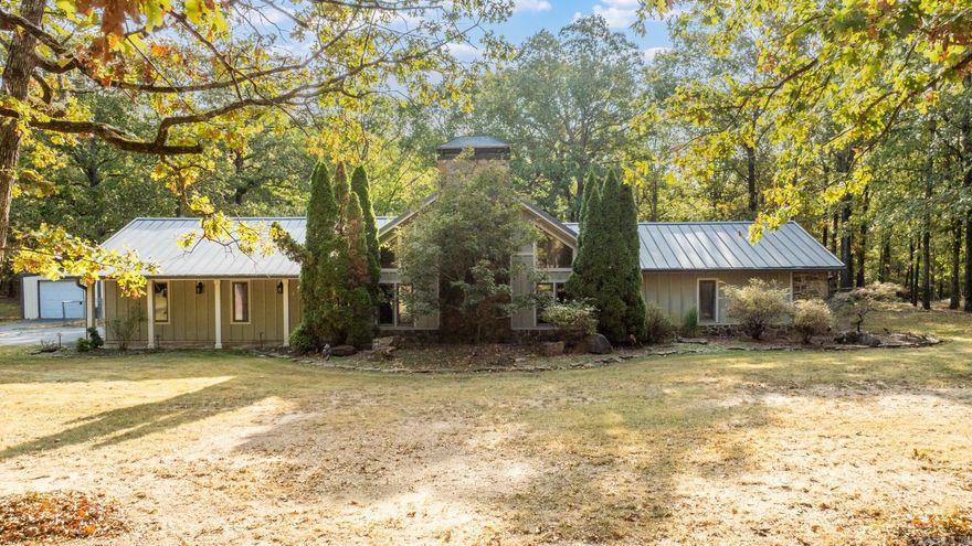 Wonderful home on two lots that equal to 6.82 acres... all behind a private,  personal gate.  The family room has a high vaulted ceiling, wood burning fireplace and hardwood floors.  The family room opens to the kitchen which features granite slab countertops, updated backsplash and an abundance of cabinets.  A large sunroom has beautiful roll out windows that open to the backyard.  A spiral staircase off the sunroom leads to a loft that overlooks the family room.  'The master bedroom is on the main level and has a walk in closet, a walk in shower and jetted tub.  The guest bedroom is also on the main level.  Large shop with garage door and two mini splits for comfort.  Two other metal buildings with garage door access.  Large laundry room and generator.  The home has a two car garage... the metal shop and other metal buildings provide ample parking for additional vehicles.