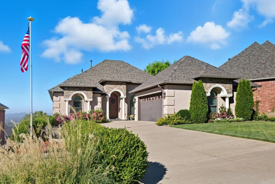 Experience luxury and tranquility at 108 Crestview Drive in Maumelle. This beautifully maintained home offers MAJESTIC VIEWS of the ARKANSAS RIVER and PINNACLE MOUNTAIN from its elevated setting. Featuring bright, open living spaces, quality finishes and a versatile floor plan, it’s ideal for both entertaining and everyday living. Primary bedroom on main level with fabulous views and the ensuite bathroom includes HEATED FLOORS. Gorgeous granite counters in the open kitchen, pot-filler over gas range, great pantry! Two dining areas + breakfast bar! With 5 bedrooms, 3 full baths, an office, an oversized laundry room with sink, and a mini-kitchenette/bar downstairs, you're ready for company! Two-car garage on the main level, one-car golf garage on the lower level - and both plumbed for an air compressor for your tinkering desires. The expansive deck provides the perfect vantage point for morning coffee or sunsets over the river. NEW ROOF and WINDOWS 2024. Beautifully landscaped and move-in ready! Conveniently located near Maumelle Boulevard yet tucked away for privacy, this home blends natural beauty with modern comfort.  *AGENTS, See Remarks*