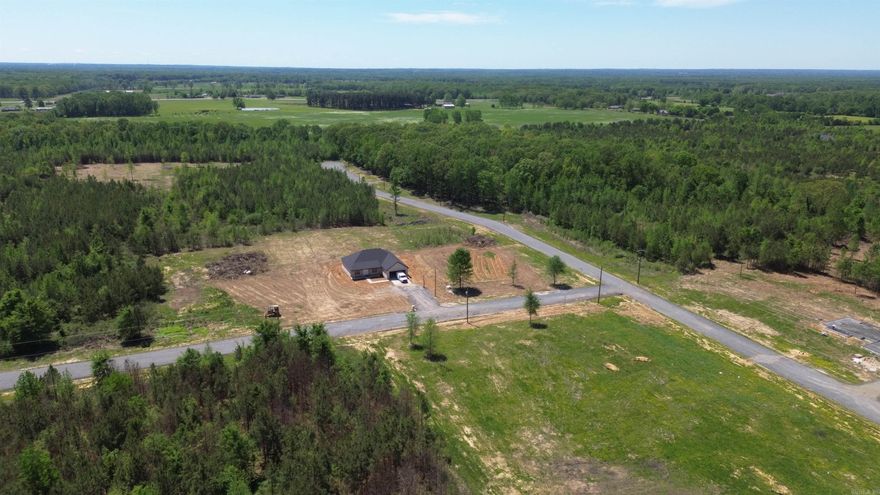 Beautiful flat 5.73+/- acre lot right outside of city limits, perfect spot if you are looking to build! Gorgeous new construction houses are going in all around. Enjoy great views of the countryside in a quiet area while only being a few minutes from the interstate. 20 mins to Vilonia, 20 mins to Searcy, & 20 mins to Cabot. Water and electric are available at the road. No mobile homes. Minimum square footage of 1700.