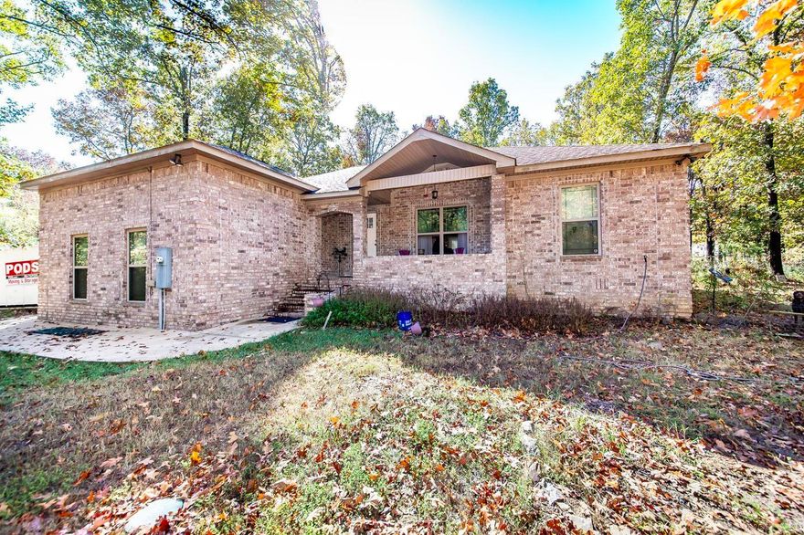 This stunning estate features three spacious bedrooms, and two modern baths, and is constructed entirely of brick. Nestled on a charming corner lot, this home offers a generous 1.21 acres of land with a fenced-in backyard. This tranquil oasis is surrounded by lush woods and a convenient two-car garage. See agent remarks!!!