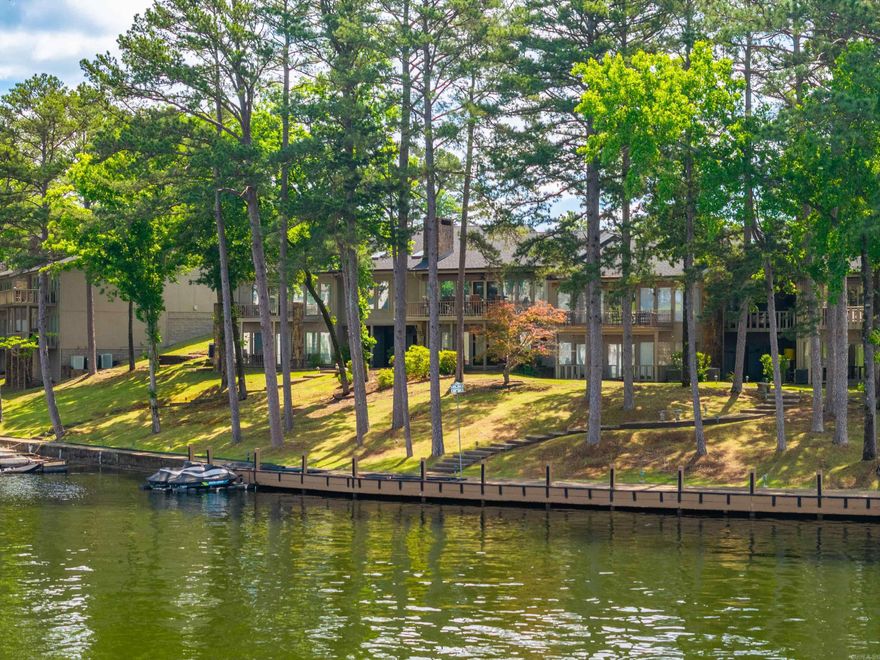 Prestigious Hamilton Pointe living! Lake Hamilton main channel WATERFRONT! TWO UNITS COMBINED to offer a rare combination of size and Luxury! The Oversized Chef-inspired Kitchen offers TWO of everything! There are not only numerous bedrooms, bathrooms, and office spaces, there are also rooms you would only expect in a high-end property.... from a Cedar-lined Storage Room to a Safe Room! Whether you choose the Private Elevator or the Grand Staircase, you will enjoy Lake Views from the Upper Deck or Lower Patio! This property was custom designed for entertaining and offers Guest Accommodations including a Lower Level Kitchen! Enjoy days on the lake or around the resort-like pool and clubhouse! Combined monthly Association Dues of $1110.58 include ground maintenance, pool & clubhouse, electric gate, pest control, garbage pickup, power washing, and share of complex insurance. These combined units boast a Generator, 4 Parking Spaces and THREE highly sought after boat slips ($150 per slip for annual moving service). EXTERIORS are all being painted now and have been paid for by current owner. NEW ROOF & Skylights!