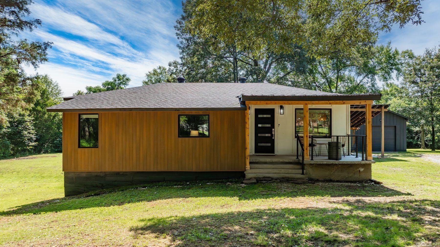 Discover this beautifully updated home on 3.5 acres in Saline County at 7616 Samples in Benton, AR. Featuring clean lines and modern updates throughout, this charming property offers 3 bedrooms, 1.5 baths, and the perfect blend of style and functionality. The main living area includes a great bonus space for a desk or cozy reading nook, while the kitchenās large windows frame peaceful views of the property. A spacious bonus room at the back of the home offers flexibilityāuse it as a second living area, flex space, or even convert it into a new primary suite. The home also includes an attached basement, ideal for extra storage or use as a storm shelter. Enjoy multiple outdoor living areas, including a welcoming front porch, a covered side porch (which could double as a carport), and a backyard fire pitāperfect for relaxing and entertaining. The land is well-maintained, with plenty of space to explore, garden, or expand. A large gravel circle drive provides ample parking, and a versatile shop in the back adds even more functionality for hobbies or storage. This home offers the peace of a private setting while remaining close to modern conveniences in town.